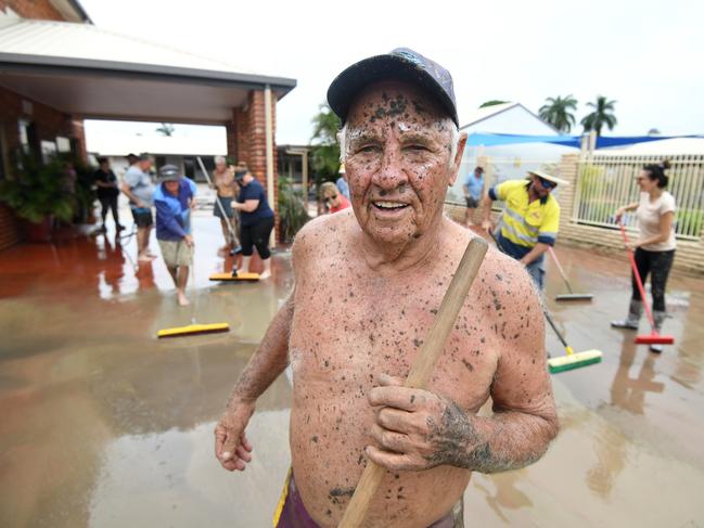 Dave Mitchell helps clean his brother's flood-affected motel in Townsville. Picture: Dan Peled/AAP