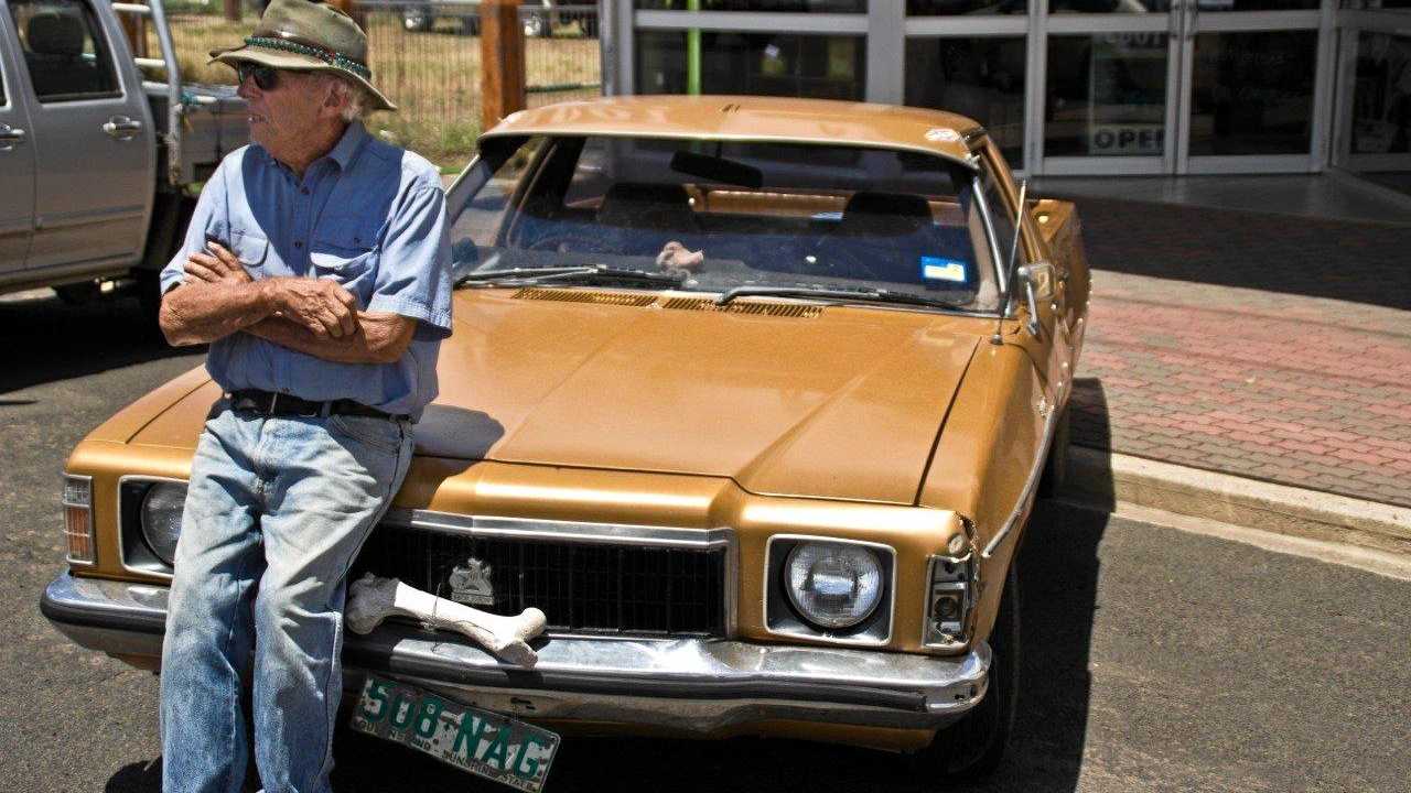 Jack with his iconic orange ute, complete with bone bumper.