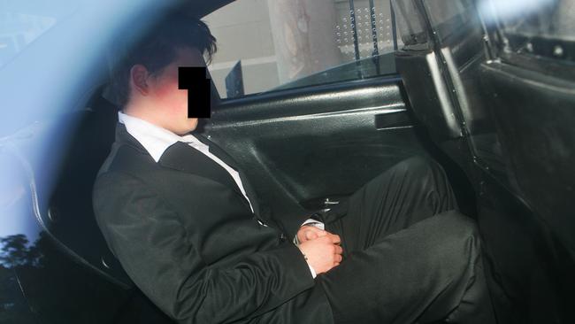 ‘DL’ leaving King Street Supreme Court in Sydney handcuffed in 2005 in the back of a Juvenile Justice vehicle after being found guilty of the murder of Tania Burgess. Picture: Supplied