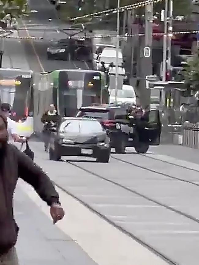 The car then sped west along the tram tracks.