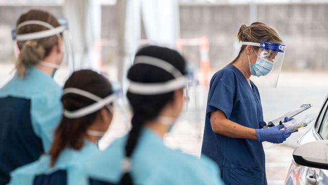 Healthcare workers administering a COVID-19 test at a drive through test centre at Bondi Beach, Sydney. Picture: NCA NewsWire / James Gourley