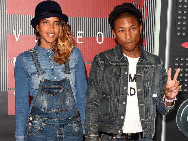 Cute couple alert! ... Helen Lasichanh and recording artist Pharrell Williams. Picture: Getty