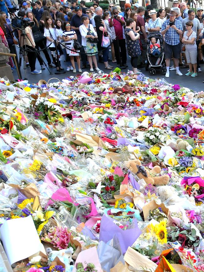 Floral tributes for victims of the Bourke Street Mall attack. Picture: Ian Currie