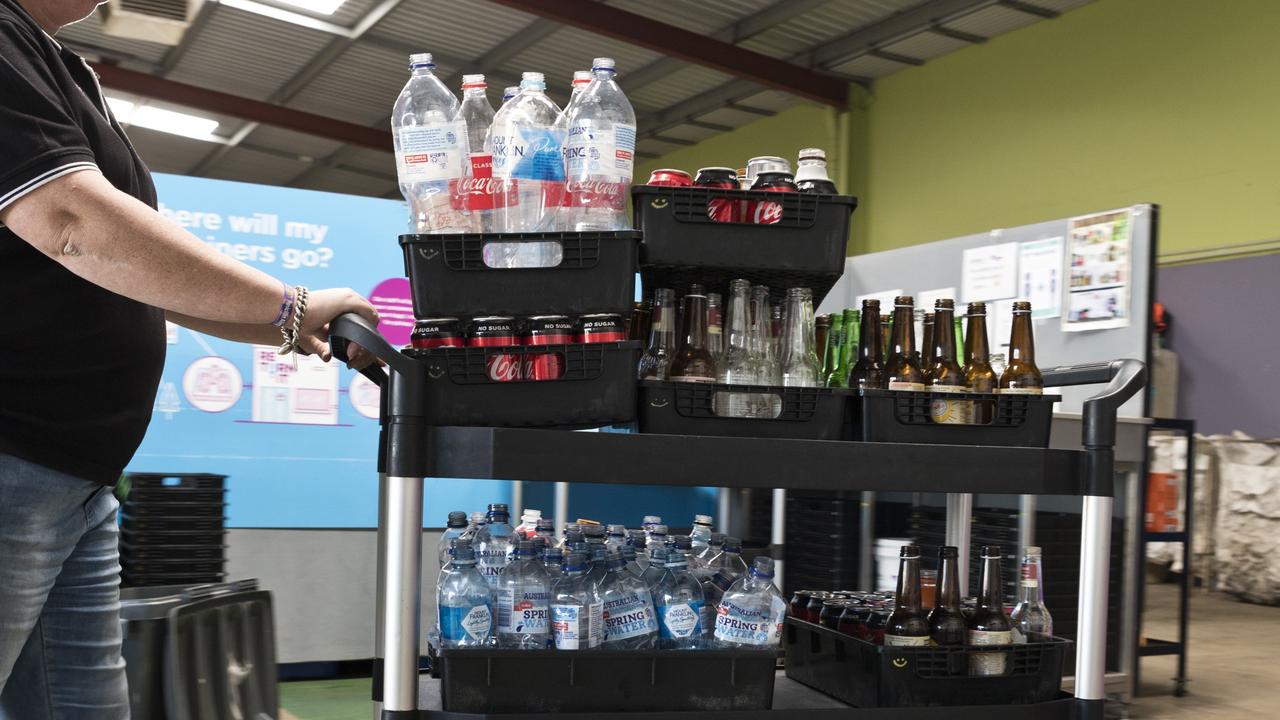 Lifeline Darling Downs business services manager Angela Klein processes a customer’s recyclables at Lifeline's Perth St Containers for Change depot.