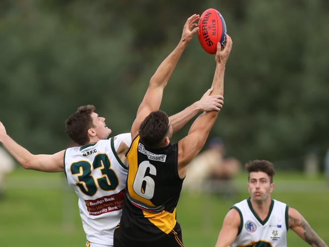 NFL Division 1 Heidelberg v Northcote 33 Paul Stenicke for Northcote is out matched by Josh Gribben of Heidelberg. Picture: Stuart Milligan