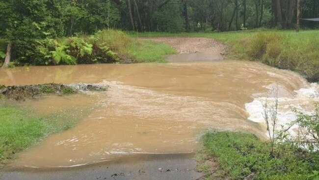 A flooded creek in the Gympie region this morning - that was "waist deep with a strong flow" . Picture: Summa Court