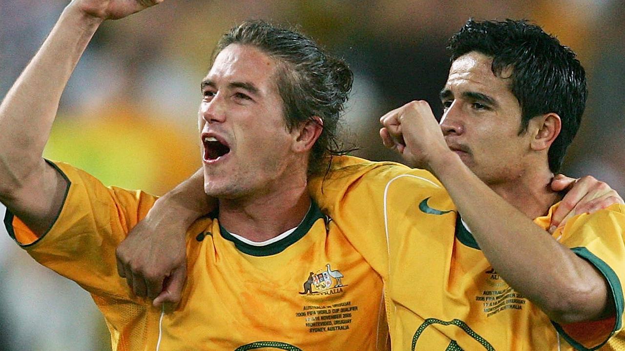 Harry Kewell and Tim Cahill celebrate after they helped Australia quality for the 2006 World Cup.