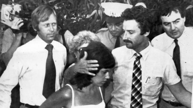 Michael, left, and Lindy Chamberlain, front, leave court after being committed for murder trial, supported by lawyer Stuart Tipple, second right.