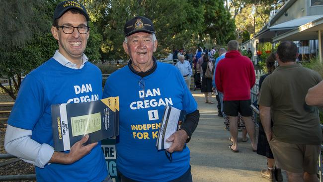 Dan Cregan handing out how-to-vote cards with supporter Ray Duthie at Littlehampton Primary School on Saturday. Picture: Naomi Jellicoe