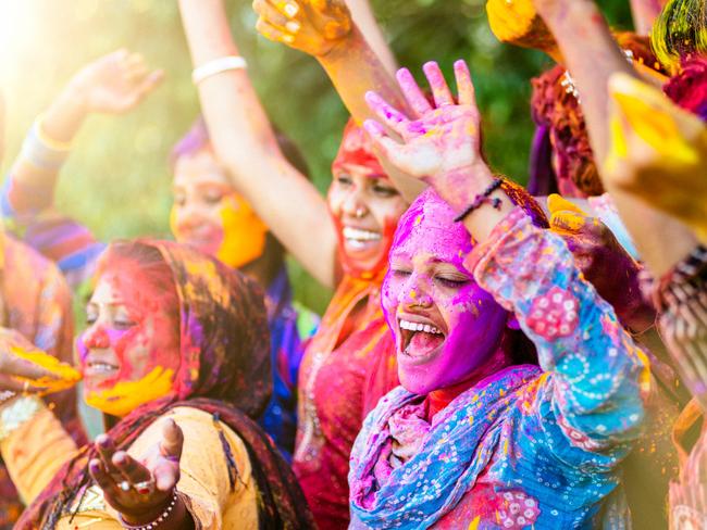 Indian women throwing colored Holi powdercredit: Getty Imagesescape13 june 2021cover story festivals