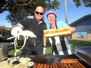 Handing the democracy sausages out at Banora Point High School are Michael and Lee-Anne Rice. Picture: Scott Powick