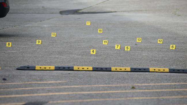 Police evidence markers in the gym carpark. Picture: NCA Newswire / Gaye Gerard