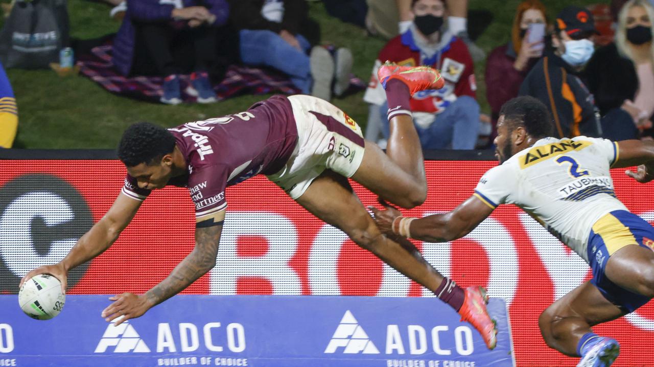 Jason Saab of the Sea Eagles scores a try.