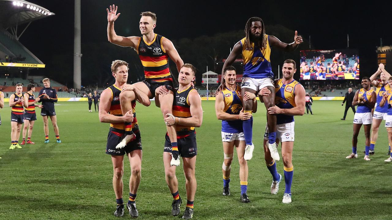 Brodie Smith being chaired off with Nic Naitanui in their 200th games was the only high point for the Crows. Picture: AFL Photos via Getty Images