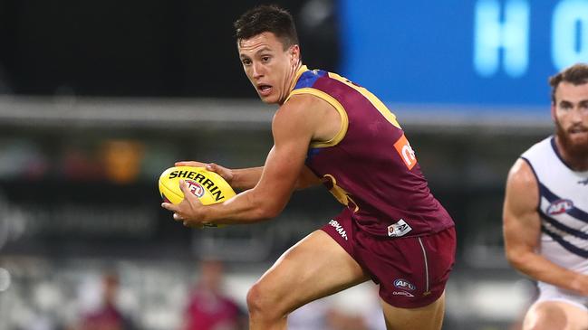 BRISBANE, AUSTRALIA - MAY 09: Hugh McCluggage of the Lions runs the ball during the round eight AFL match between the Fremantle Dockers and the Brisbane Lions at The Gabba on May 09, 2021 in Brisbane, Australia. (Photo by Chris Hyde/Getty Images)