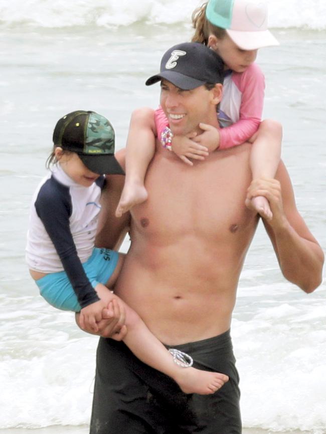 Grant Hackett on the beach at Miami with children Charlize and Jagger.