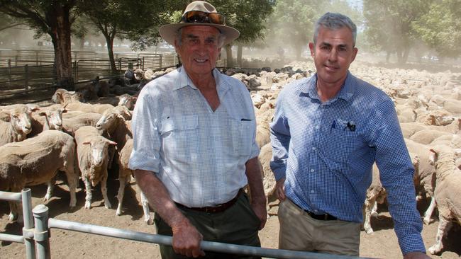 Merino buyers: Keith Buckingham, from Jerilderie, and agent Michael Baker, from Rodwells Echuca, paid $248 for the five-year-old Mooloomoon Merino ewes at the Deniliquin store sheep sale last week.