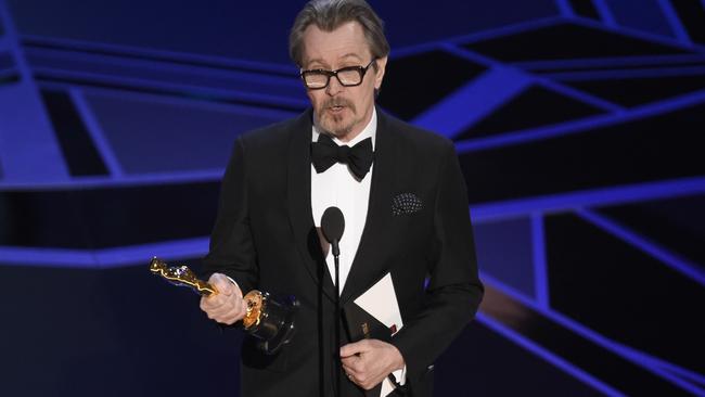 Gary Oldman accepts the best actor Oscar. Picture: AP