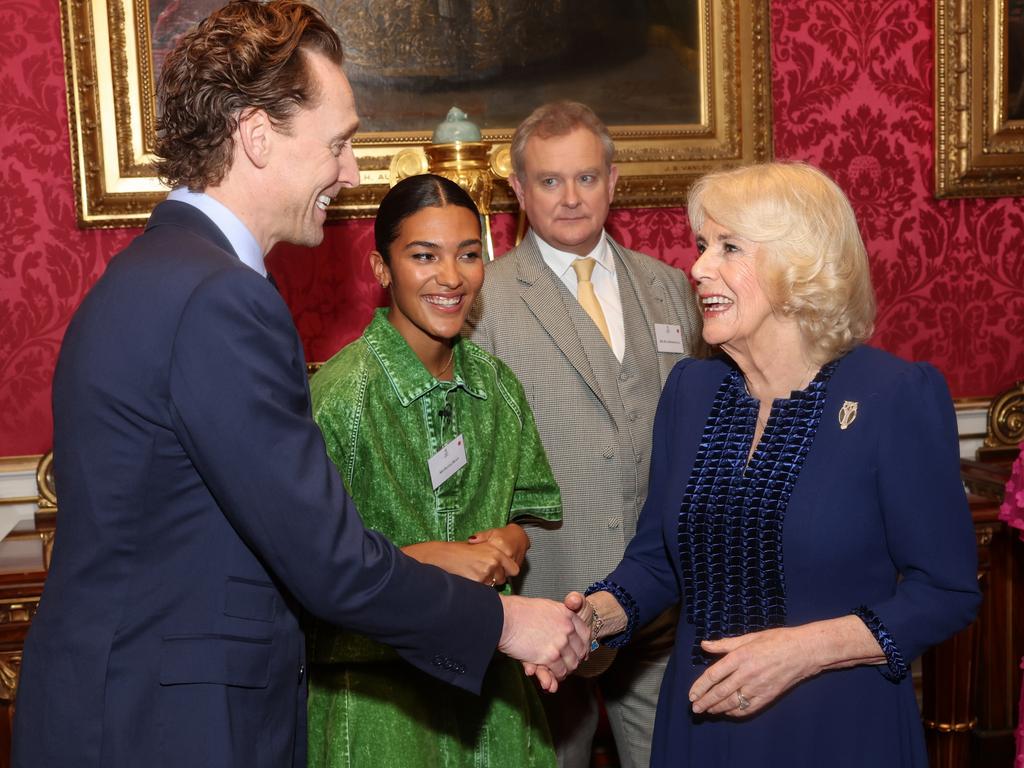 Queen Camilla with actor Tom Hiddleston during a reception for the BBC's 500 Words Finalists at Buckingham Palace. Picture: Getty Images