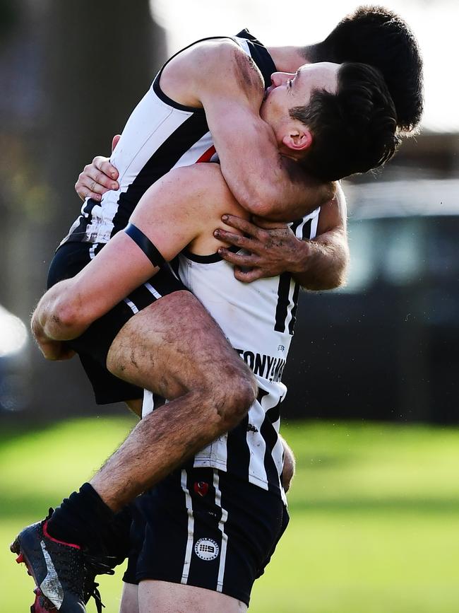 Payneham Norwood Union’s Alex Forster celebrates with teammate Anthony Giannini. Picture: AAP/Mark Brake