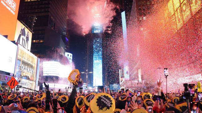 Confetti and fireworks in Times Square, New York. Picture: AFP