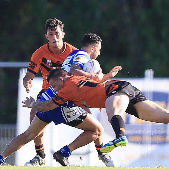 Tully's Shane Cliff flies through the air to tackle Brothers’ Patrick Lewis during the 2018 CDRL preliminary final between Brothers Cairns and Tully Tigers at Barlow Park, Cairns. PICTURE: JUSTIN BRIERTY