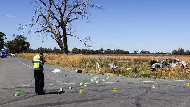 Police at the scene at the corner of Pine Lodge North and Cosgrove-Lemnos roads where four men were killed when a car collided with a ute carrying a trailer. Picture: Ian Currie