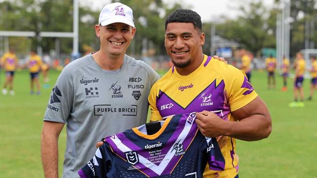 WELCOME HANDOVER: Ex-Ipswich Jets player Marion Seve checks out his new Melbourne strip with former Jets staffer Matthew Barradeen at Melbourne Storm.