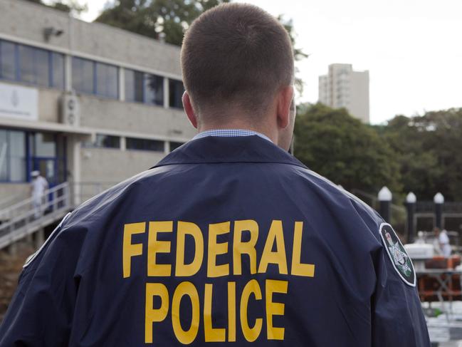 This handout photo released by the Australian Federal Police on February 6, 2017 shows a policeman guarding a yacht from which cocaine was seized on the New South Wales coast by the Australian Federal Police. Australia has made its largest cocaine haul ever after seizing a yacht carrying 1.4 tonnes of the drug with an estimated street value of Aus$312 million (US$239 million). The boat was stopped off the New South Wales coast on February 2 and six men were arrested, police said on February 6, following a two-and-a-half year joint investigation between Australia and New Zealand. / AFP PHOTO / Australian Federal Police / STR / RESTRICTED TO EDITORIAL USE - MANDATORY CREDIT "AFP PHOTO / AUSTRALIAN FEDERAL POLICE" - NO MARKETING NO ADVERTISING CAMPAIGNS - DISTRIBUTED AS A SERVICE TO CLIENTS - NO ARCHIVES