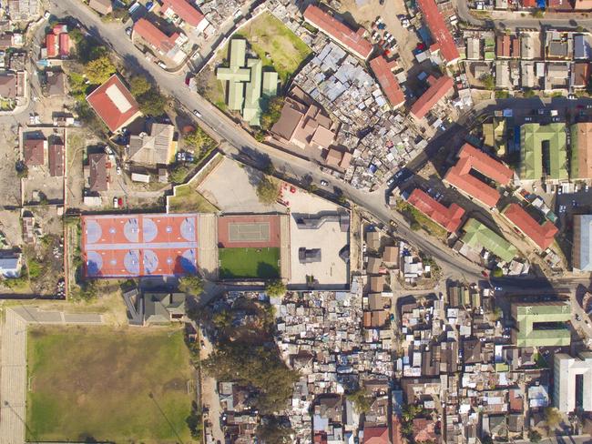 Unequal Scenes: Segregation of urban spaces in South Africa. Picture: Johnny Miller/Millefoto/Rex Shutterstock/Australscope