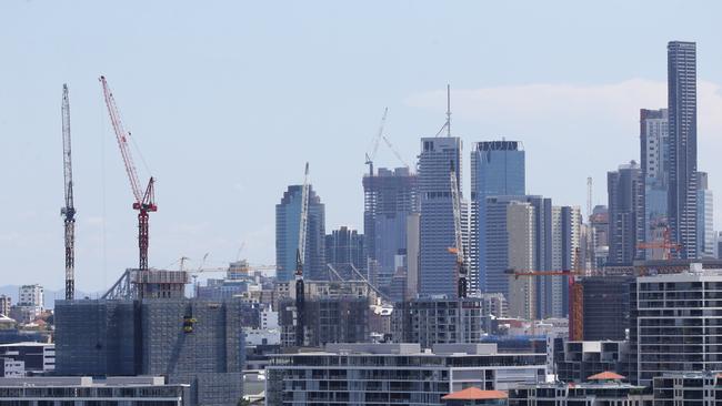 Four BASE jumpers have been charged after jumping off a crane in Brisbane. Picture: Peter Wallis