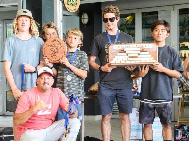 The Burleigh Boardriders won their first ever Straddie Teams Assault. Tom Whitby, Harry Martin, Rico Haybittle and Liam O’Brien hold the winning team’s trophy with Sein Fujimoi. Crouching is coach Kyle Robinson. Picture: Fiona Pyke/Straddie Surf Pics