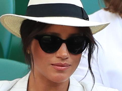 ONE TIME WEB USE ONLY - FEE APPLIES FOR REUSE -  Previously unissued picture dated 4/7/2019 of a man believed to be a Royal bodyguard speaking to a spectator who had taken a selfie as the Duchess of Sussex watches the Serena Williams match on court one during day four of the Wimbledon Championships at the All England Lawn Tennis and Croquet Club, Wimbledon. (Photo by Mike Egerton/PA Images via Getty Images)