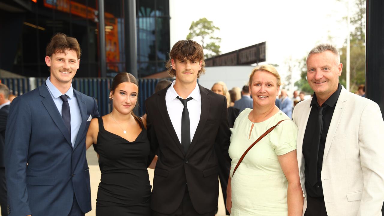 Graduate Damien Hewson, centre, with brother Tayne and girlfriend Clem Mills and parents Leeann and Grant at the Belmont High School year 12 graduation at GMHBA Stadium. Picture: Alison Wynd