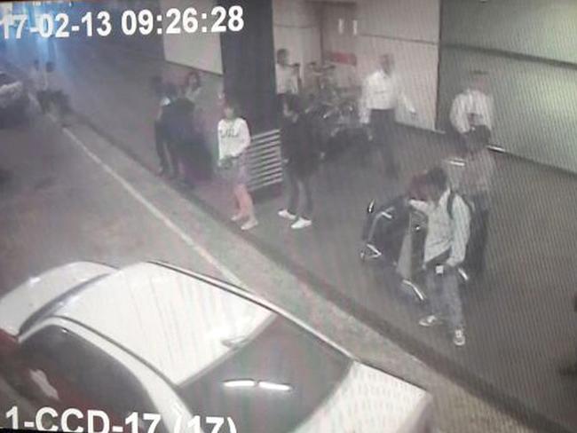 Closed circuit television footage from Monday shows a woman (centre, in white) at Kuala Lumpur International Airport, who police say was arrested on Wednesday in connection with the death of Kim Jong-nam. Picture: Star TV via AP