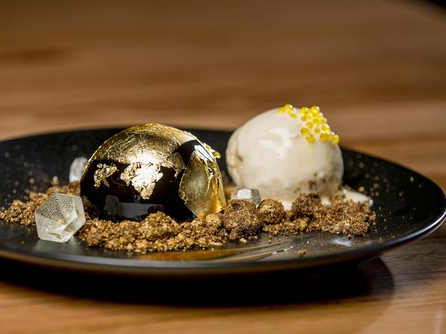 The 24K dessert is covered in real gold flakes and powder — all for $14. Picture: Jerad Williams