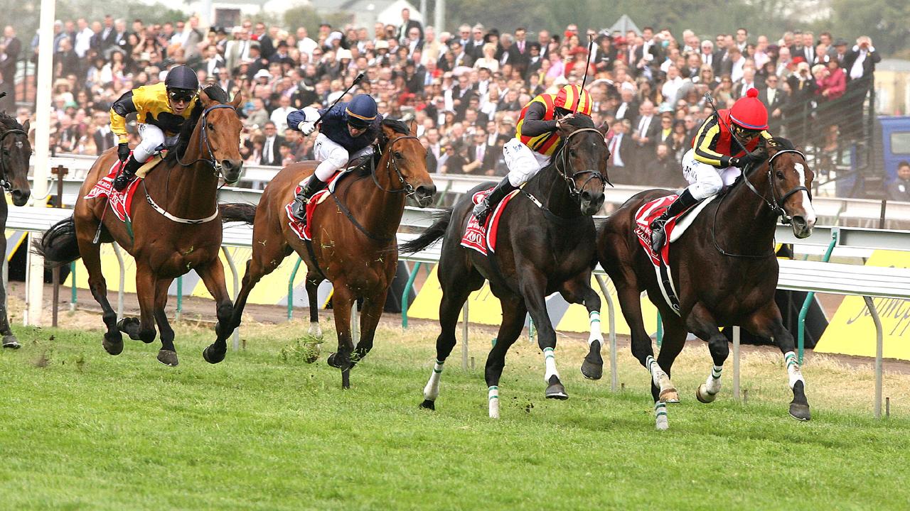 07 Nov 2006 Melbourne Cup Race 7 at Flemington - Delta Blues (front, rails) ridden by jockey Yasunari Iwata beats Pop Rock ridden by Damien Oliver with Maybe Better ridden by Chris Munce (Yellow, 3rd) and Zipping ridden by Glen Boss (4th) - sport horseracing action