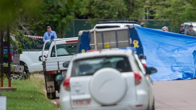 Police use tarpaulins to block the scene from onlookers as they carry out their investigations. Picture: Che Chorley