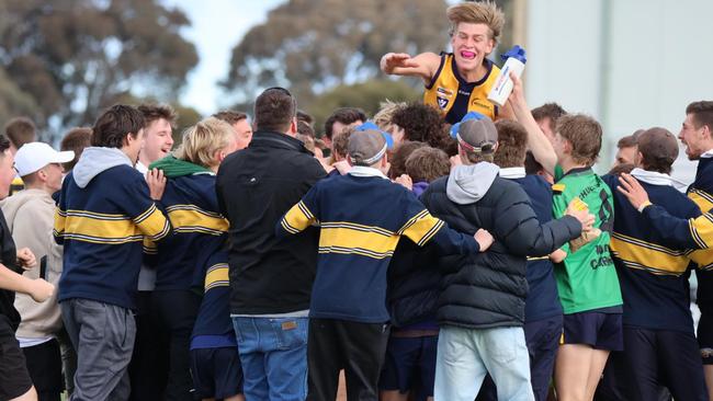 James Harvey's Echuca United teammates and supporters mob him after his clever left-foot snap.