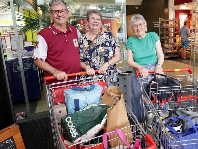 L to R, Andy and Jenny Andrews, and Jenny Boyd, at Coles in The Gap shopping centre, were shopping to stock up because of the threat of cyclone Alfred, some shelves were empty at supermarkets due to the cyclone - on Monday 3rd March 2025 - Photo Steve Pohlner