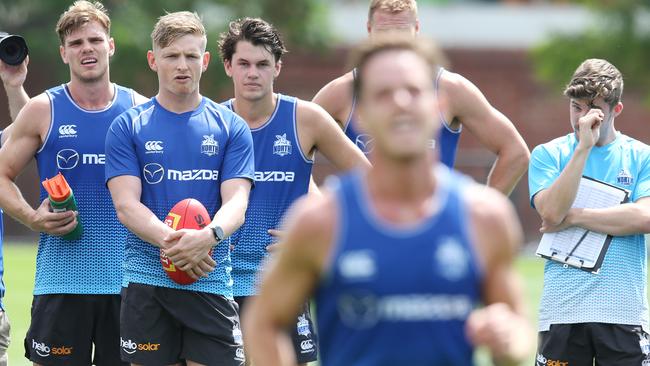 Captain Jack Ziebell, second from left, watches on at training.