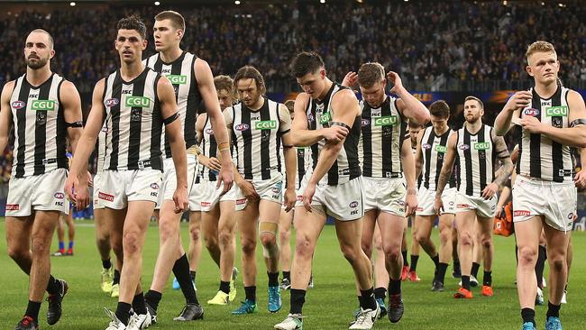 The Magpies walk from the field after being Collingwood players leave Perth Stadium. Picture: Getty Images