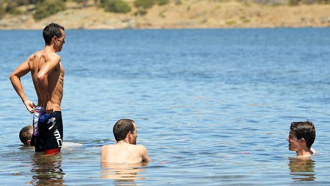 ADELAIDE, AUSTRALIA - JANUARY 18: Richie Porte of Australia and BMC Racing Team, Rohan Dennis of Australia and BMC Racing Team and Miles Scotson of Australia and BMC Racing Team cool off in the ocean after stage three of the 2018 Tour Down Under on January 18, 2018 in Adelaide, Australia.  (Photo by Daniel Kalisz/Getty Images)