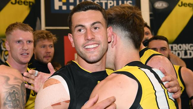 Jack Graham is hugged by teammates after Richmond’s preliminary final win against Geelong. Picture: Getty Images