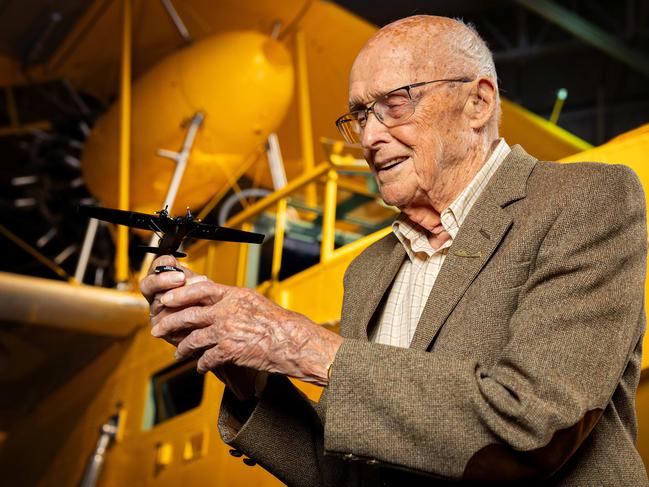 Mordaunt Mitchell holds a replica Catalina presented to him along with an Air Commanders Coin at the RAAF Museum in Point Cook, Melbourne. Picture: Mark Stewart
