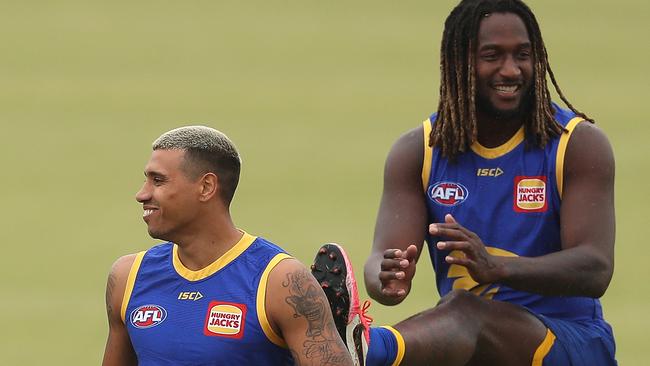 Tim Kelly and Nic Naitanui warm up during a West Coast training session on May 26. Picture: Paul Kane/Getty Images