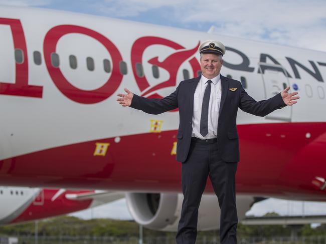 Qantas first officer James Tapp with the Qantas 787 Dreamliner he flies.  Pic Peter Wallis