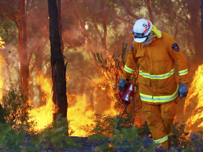 FIRE AT PETER MURRELL RESERVE.  Tasmanian Fire Service Forestry personnel got control of a bushfire at Peter Murrell Reserve, Blackmans Bay very quickly.  They were aided by light winds, bordering fire trails and roads and back burning. PIC: MATT THOMPSON