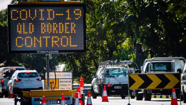 A sign at a Pacific Highway vehicle checkpoint on the Queensland-NSW border near Coolangatta. Picture: AFP