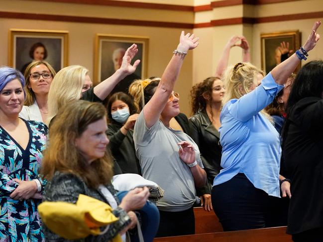 Spectators wave to actor Johnny Depp after closing arguments at the Fairfax County Circuit Courthouse in Fairfax, Virginia. Picture: AFP